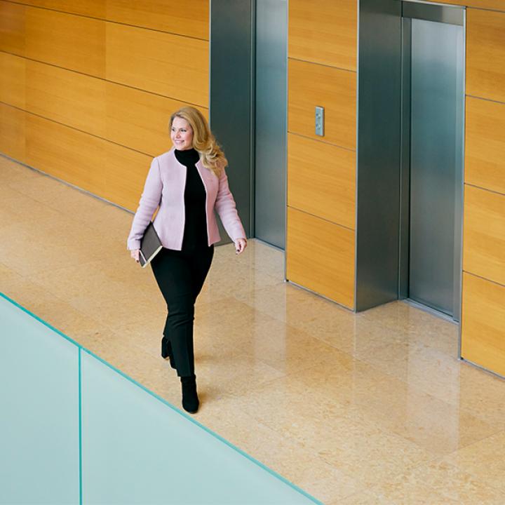 woman walking at a company building